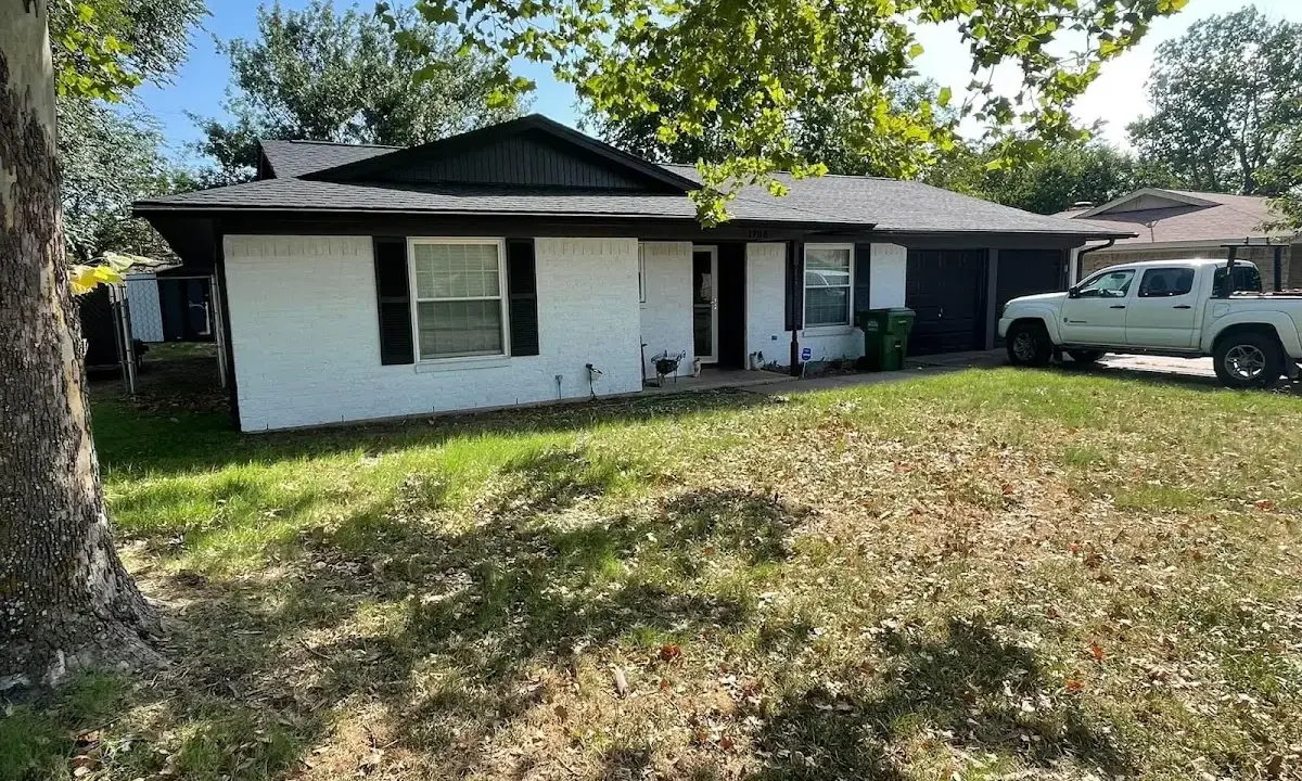 Professional roofing crew working on a residential roof in Gulfport